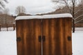 Crisp snow on a rusty metal gate