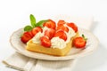 Crisp waffle with strawberries and cream Royalty Free Stock Photo