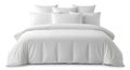 Crisp white comforter and pillows on a bed Royalty Free Stock Photo
