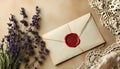 a red wax stamp on a white envelope with a bunch of lavender flowers