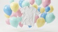 A crisp white t-shirt floats with an array of soft pastel balloons Royalty Free Stock Photo