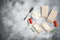 Crispbreads with feta, on gray stone table background, top view flat lay, with copy space for text Royalty Free Stock Photo