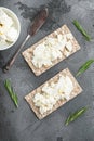 Crispbreads with feta, on gray stone table background, top view flat lay Royalty Free Stock Photo