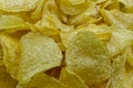 Crisps in bowl, potato chips, isolated on white background. Close up