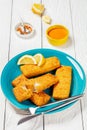 crispy baked battered pollock fillet on a plate