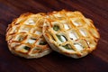Puff pastries with spinach and goat cheese on wooden surface Royalty Free Stock Photo