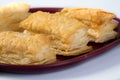 Crispy Baked Puffs in plate on white background