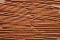 Crispy bread straw on brown paper background Royalty Free Stock Photo