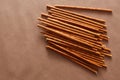 Crispy bread straw on brown paper background Royalty Free Stock Photo