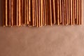 Crispy bread straw on brown paper background Royalty Free Stock Photo