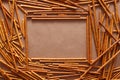 Crispy bread straw on brown paper background