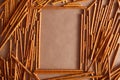 Crispy bread straw on brown paper background