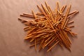 Crispy bread straw on brown paper background