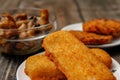 Fried fish filet, veggie burger and grilled champignons Royalty Free Stock Photo