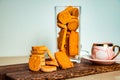 Crispy Cookies biscuits and cup of coffee isolated on wooden board side view of breakfast bakery items on table Royalty Free Stock Photo