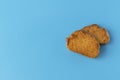 Crispy cracker on a blue background. Salty tea biscuits. Healthy Diet Snack.