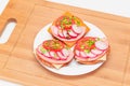 Crispy Cracker Sandwiches with Tomato, Sausage, Cheese, Green Onions and Radish Royalty Free Stock Photo