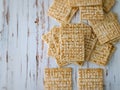 Crispy crackers arranged on a rustic wooden surface Royalty Free Stock Photo