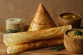 Crispy crepes made of barnyard millets and lentils. Commonly known as barnyard milled ghee roast dosa. Plated in conical shape and