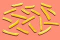 Crispy crinkle cut potato chips on orange