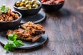 Crispy crostini with tapenade and ingredients