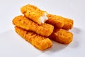 Crispy fish fingers against white background Royalty Free Stock Photo