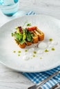 Crispy fish roulade with greens and white sauce drops Royalty Free Stock Photo