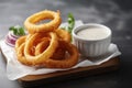 A crispy and flavorful serving of onion rings. (Generative AI)