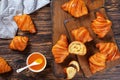 Crispy french croissants and apricot jam Royalty Free Stock Photo