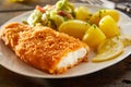 Crispy fresh breaded fish with potatoes