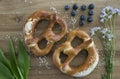 Bavarian salted sesame pretzels on table.