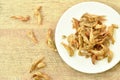 Crispy fried anchovy fish with salt on plate Royalty Free Stock Photo