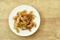 Crispy fried anchovy fish with salt on plate Royalty Free Stock Photo