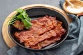 Crispy fried bacon in a cast iron pan Royalty Free Stock Photo