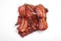 Crispy fried bacon isolated on a white background. Royalty Free Stock Photo