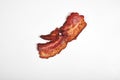 Crispy fried bacon isolated on a white background.