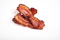 Crispy fried bacon isolated on a white background. Royalty Free Stock Photo