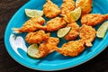 Crispy Fried Butterfly Shrimp on a blue plate