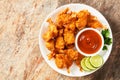 Crispy Fried Butterfly Shrimp on a white plate