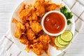 Crispy Fried Butterfly Shrimp on a white plate