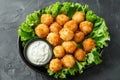 Crispy fried cheese bites with creamy dipping sauce