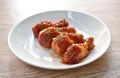 Crispy fried chicken drum wing dressing tomato sauce and topping oregano on plate Royalty Free Stock Photo