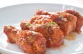 Crispy fried chicken drum wing dressing tomato sauce and topping oregano on plate Royalty Free Stock Photo