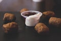 Crispy fried chicken nuggets, fried meat cutlets rissole meatballs of minced pork and french fries on a wooden dark background. Royalty Free Stock Photo