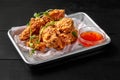 Crispy fried chicken wings in batter with sweet chili sauce
