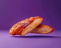 Crispy Fried Chicken Wings Floating in Air Against Violet Background, Fast Food Concept with Copy Space Royalty Free Stock Photo
