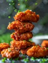 Crispy Fried Chicken Wings Stacked with Spices Sprinkling Down on Dark Background Royalty Free Stock Photo