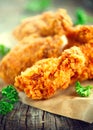 Crispy fried chicken wings on wooden table Royalty Free Stock Photo