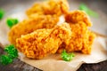 Crispy fried chicken wings on wooden table Royalty Free Stock Photo