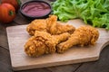 Crispy fried chicken on wooden plate and dip sauce Royalty Free Stock Photo